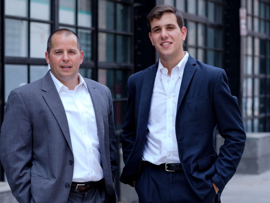 Image of Andrew Levine and Josh Lipton meeting with commercial real estate consulting services, preparing to discuss commercial properties in Harlem